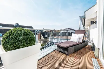 Ein Balkon oder eine Terrasse in der Unterkunft HOME Suites Beachloft Alte Bergstr 13