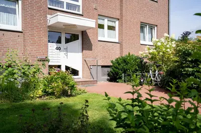 Ein Garten an der Unterkunft Kleiner Knurrhahn Scharbeutz 300 m zum Strand