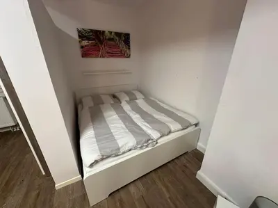 Ein Bett oder Betten in einem Zimmer der Unterkunft Wohnung in Uni-Nähe