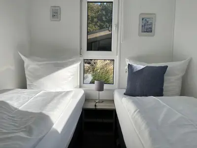 Ein Bett oder Betten in einem Zimmer der Unterkunft Ostseecamp Spatzennest