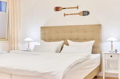 Ein Bett oder Betten in einem Zimmer der Unterkunft Residenz Johannsens Ap B13