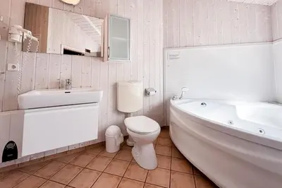 Ein Badezimmer in der Unterkunft Strandblick - Dorf 1 Ferienhaus 06