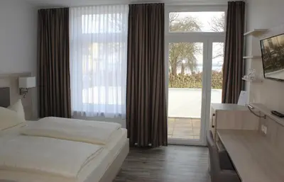 Ein Bett oder Betten in einem Zimmer der Unterkunft Hotel Sonnenklause