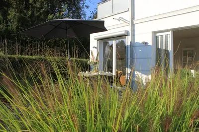 Ein Garten an der Unterkunft Ferienwohnung Alter Sandweg inklusive Strandkorb