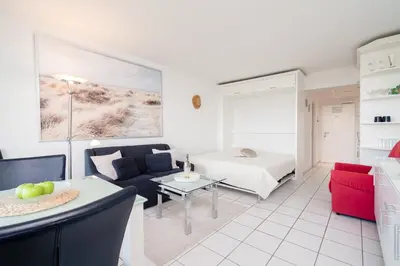 Ein Bett oder Betten in einem Zimmer der Unterkunft TimmenKoje App 290