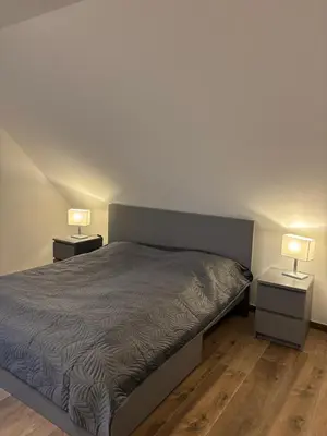 Ein Bett oder Betten in einem Zimmer der Unterkunft OstseeLiebe