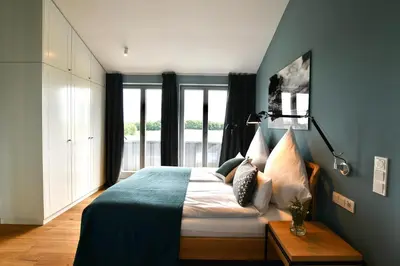 Ein Bett oder Betten in einem Zimmer der Unterkunft Schöne Aussicht Rosenhagen Haus 6