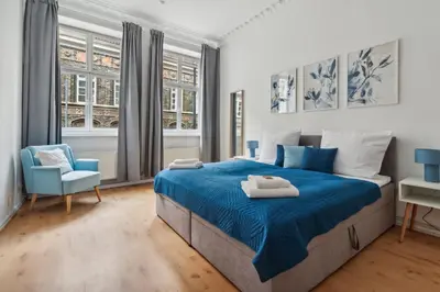 Ein Bett oder Betten in einem Zimmer der Unterkunft Moderne Ambient Apartments direkt in der Lübecker Altstadt