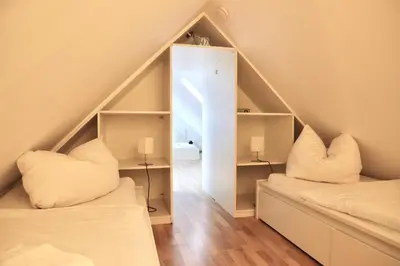 Ein Bett oder Betten in einem Zimmer der Unterkunft Apartments Meerzeit A