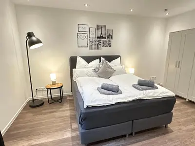Ein Bett oder Betten in einem Zimmer der Unterkunft M&K Homes Eleganter Neubau zwischen Hamburg&Ostsee mit Parkplatz