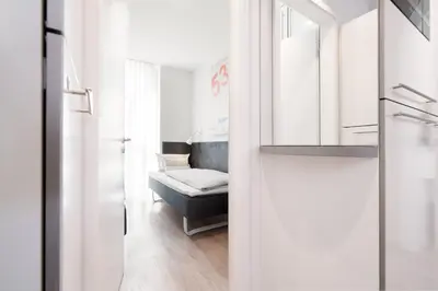 Ein Bett oder Betten in einem Zimmer der Unterkunft Ferienwohnung Hafenkino 23
