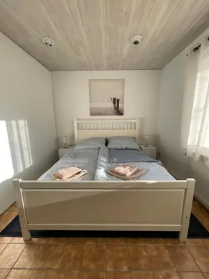 Ein Bett oder Betten in einem Zimmer der Unterkunft Geibel-Haus Bungalow Sunset bis 4 Personen