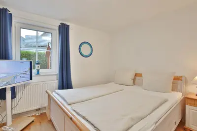 Ein Bett oder Betten in einem Zimmer der Unterkunft Min Söl Appartement 1 und 2