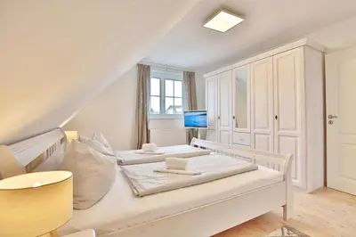 Ein Bett oder Betten in einem Zimmer der Unterkunft Das Friesenhaus