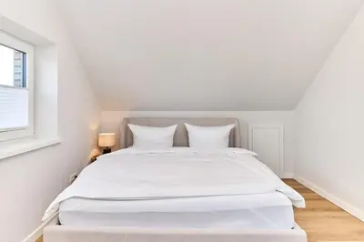 Ein Bett oder Betten in einem Zimmer der Unterkunft Saltwater House Scharbeutz Sail Away Scharbeutz