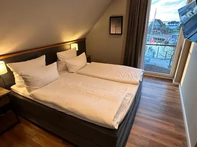 Ein Bett oder Betten in einem Zimmer der Unterkunft 4Hafenzeiten - NIE12 Memel