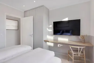 Ein Bett oder Betten in einem Zimmer der Unterkunft Modernes Ostsee Luxus-Penthouse Meerblick