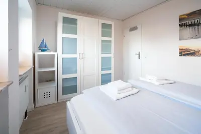 Ein Bett oder Betten in einem Zimmer der Unterkunft Ferienwohnung Möwensand