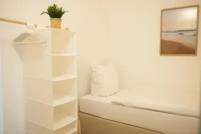 Ein Bett oder Betten in einem Zimmer der Unterkunft FeWo mit Panoramablick am Hansapark
