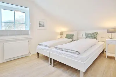 Ein Bett oder Betten in einem Zimmer der Unterkunft Wohnpark Niendorf 13 Wohnpark Niendorf Appartement 6