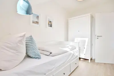 Ein Bett oder Betten in einem Zimmer der Unterkunft Wohnpark Niendorf 13 Wohnpark Niendorf Appartement 6