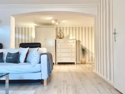 Ein Sitzbereich in der Unterkunft Entspannungssuite Küstenkind direkt am Strand Souterrain Wohnung