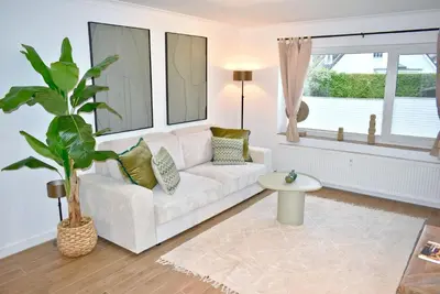 Ein Bett oder Betten in einem Zimmer der Unterkunft Küstenzauber Appartement