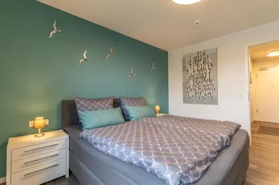 Ein Bett oder Betten in einem Zimmer der Unterkunft Neue Liebe Haffkrug 4
