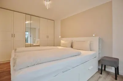 Ein Bett oder Betten in einem Zimmer der Unterkunft Haus Seerose Seerose II Appartement 11
