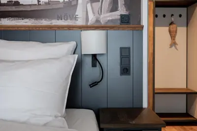 Ein Bett oder Betten in einem Zimmer der Unterkunft 4Hafenzeiten - NIE3 Möve