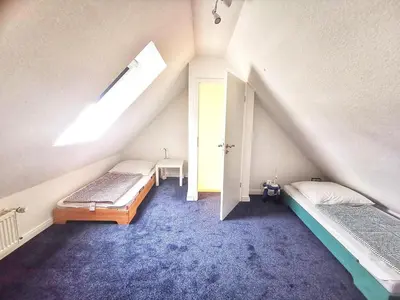 Ein Bett oder Betten in einem Zimmer der Unterkunft Obj 87 Familiy Ferienhaus für 2-6 Personen 100 m zum Strand, Garten