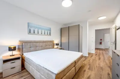 Ein Bett oder Betten in einem Zimmer der Unterkunft Ferienwohnung Strandkorb Rosenhagen bei Travemünde