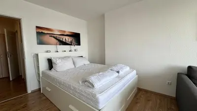 Ein Bett oder Betten in einem Zimmer der Unterkunft Penthousewohnung mit traumhaften Ausbilck auf den Segeberger See
