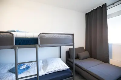 Ein Bett oder Betten in einem Zimmer der Unterkunft Strandkoje 104