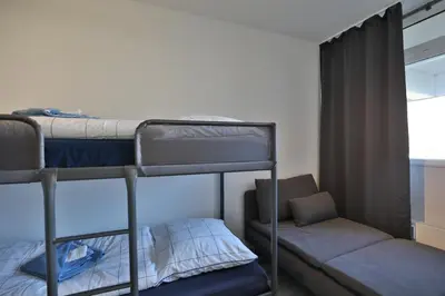 Ein Bett oder Betten in einem Zimmer der Unterkunft Strandkoje 106