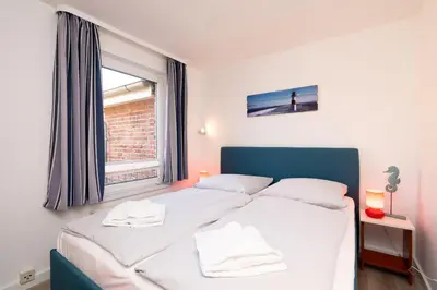 Ein Bett oder Betten in einem Zimmer der Unterkunft Ferienwohnung 