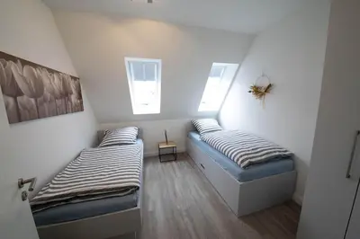Ein Bett oder Betten in einem Zimmer der Unterkunft Hyggehuus