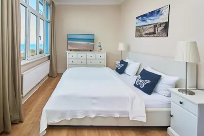 Ein Bett oder Betten in einem Zimmer der Unterkunft Villa Dünenblick Apartment Meeresbrise