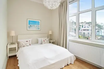 Ein Bett oder Betten in einem Zimmer der Unterkunft Villa Dünenblick Apartment Strandkieker