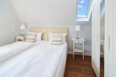 Ein Bett oder Betten in einem Zimmer der Unterkunft Villa Dünenblick Beachhouse Apartment Sunset