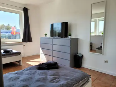 Ein Bett oder Betten in einem Zimmer der Unterkunft Work & Relax Apartment in Industrial area