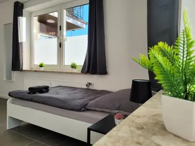 Ein Bett oder Betten in einem Zimmer der Unterkunft Work & Relax Apartment in Industrial area