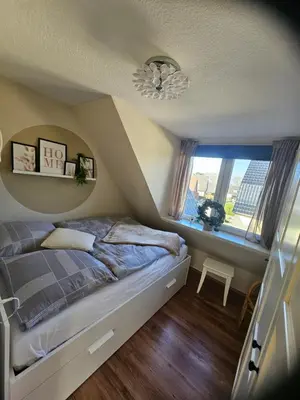 Ein Bett oder Betten in einem Zimmer der Unterkunft Kleine Kajüte