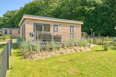Ein Garten an der Unterkunft Ostseecamp Ferienhaus 