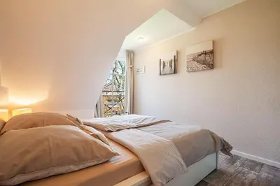 Ein Bett oder Betten in einem Zimmer der Unterkunft Strandliebe