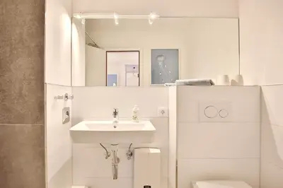 Ein Badezimmer in der Unterkunft Ferienanlage Bergstraße 62 Ferienhaus Bergstraße 62 Appartement 5 Tide am Park