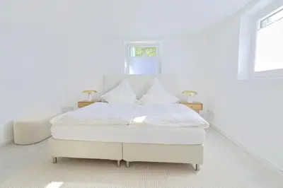 Ein Bett oder Betten in einem Zimmer der Unterkunft Souterrain in Timmendorfer Strand - Niendorf Ostsee
