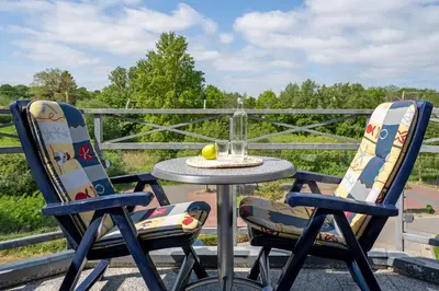 Ein Balkon oder eine Terrasse in der Unterkunft Nimm dir Zeit für Meer
