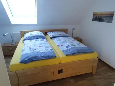 Ein Bett oder Betten in einem Zimmer der Unterkunft Niendorf Ostsee Ferienwohnung