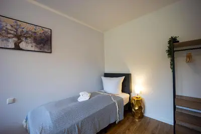 Ein Bett oder Betten in einem Zimmer der Unterkunft HejU - Gemütliche Auszeit am Meer
